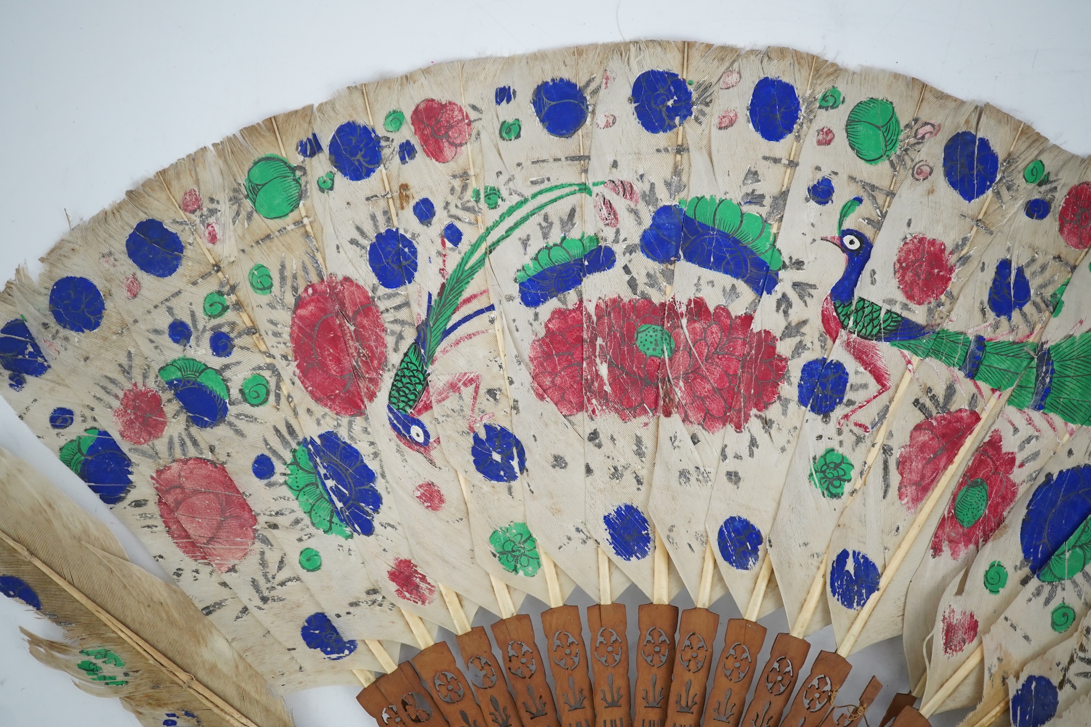 Three 19th century Chinese feather fans: One a carved bone brise black feather fan together with two similar carved sandalwood feather fans, two fans have hand painted decoration on the feathers both sides, the pink feat